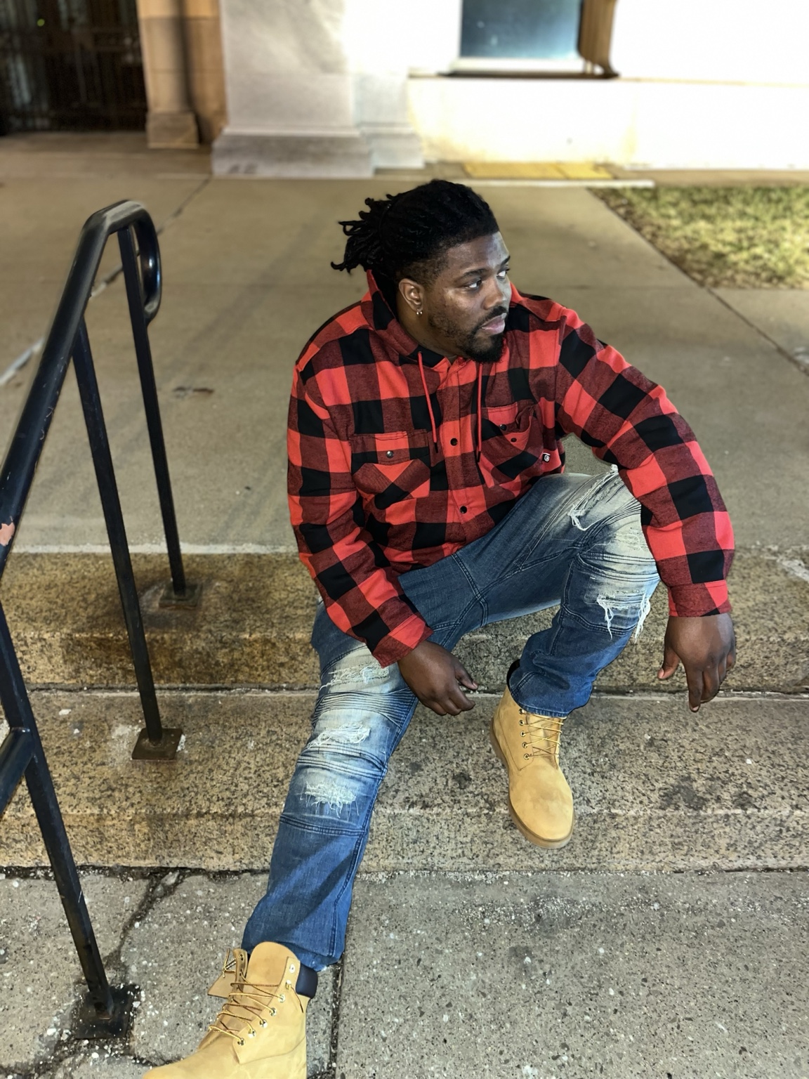 Chris Lanard seated outside in Detroit